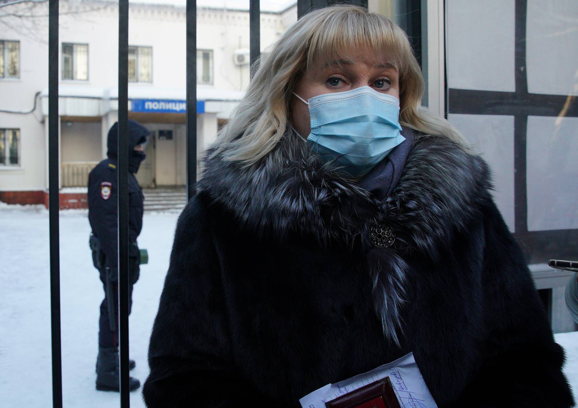 Olga Mikhailova, lawyer of Russian opposition leader Alexei Navalny, speaks to the media outside a police station, in Khimki