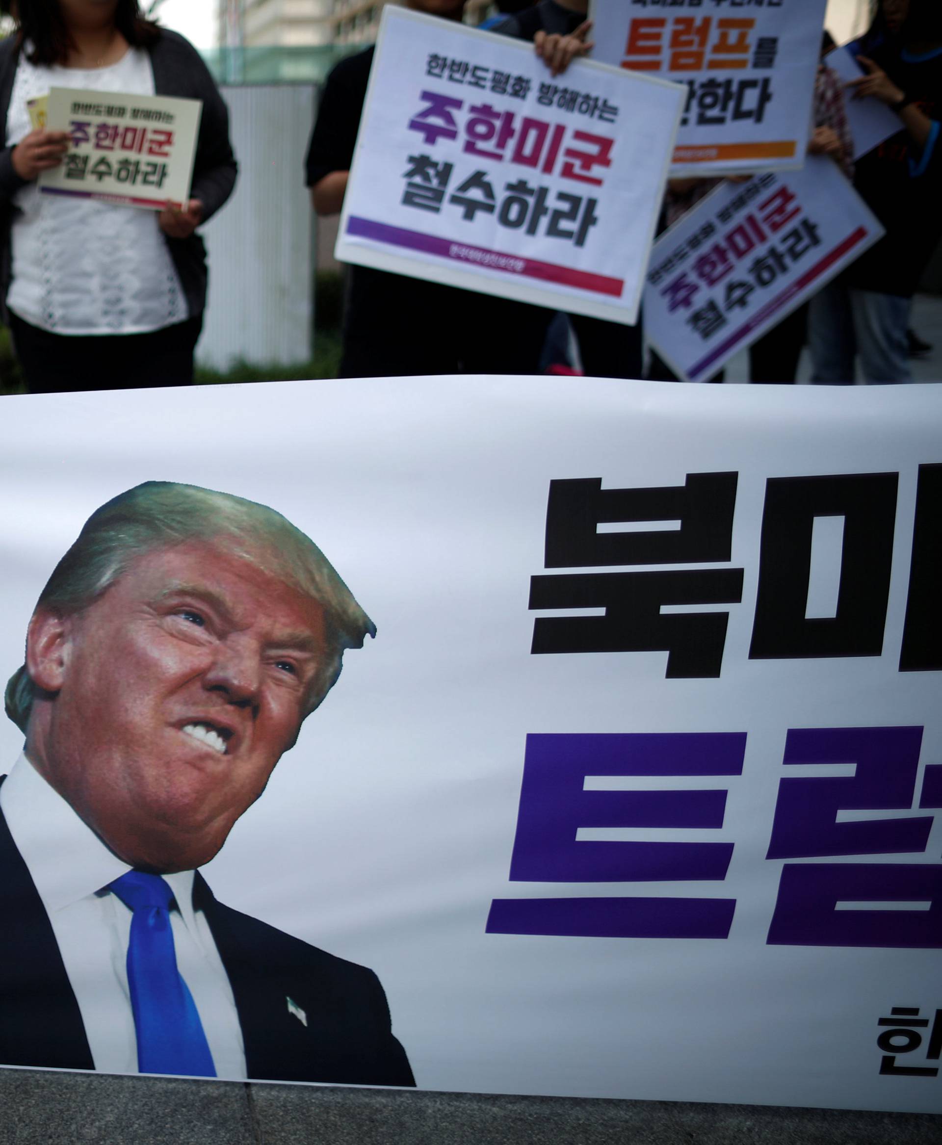 University students attend a protest against U.S. President Donald Trump near U.S. embassy in Seoul