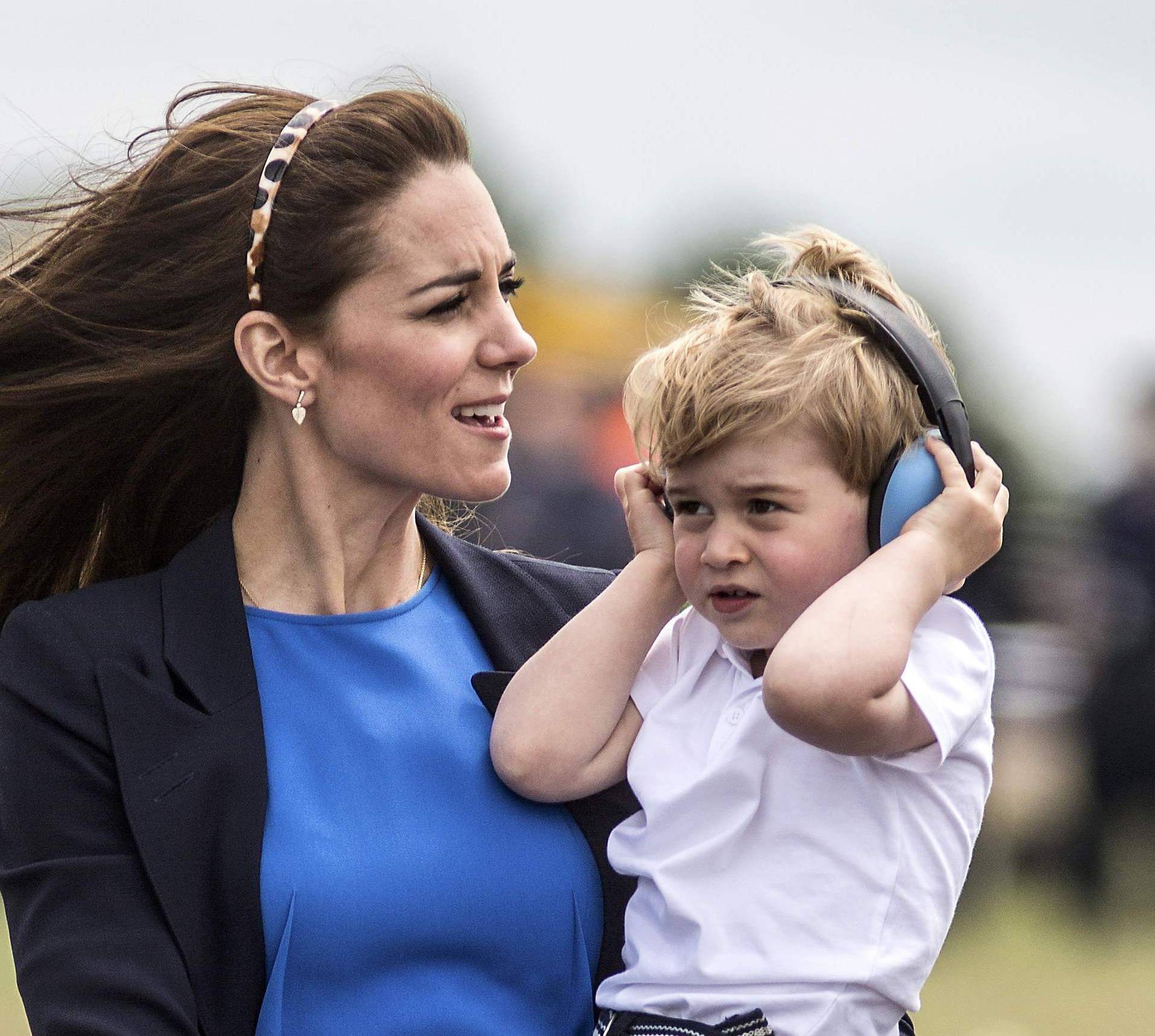 Prince George wears ear defenders against the roar of aircraft during a visit to the Royal international air tattoo at RAF Fairford