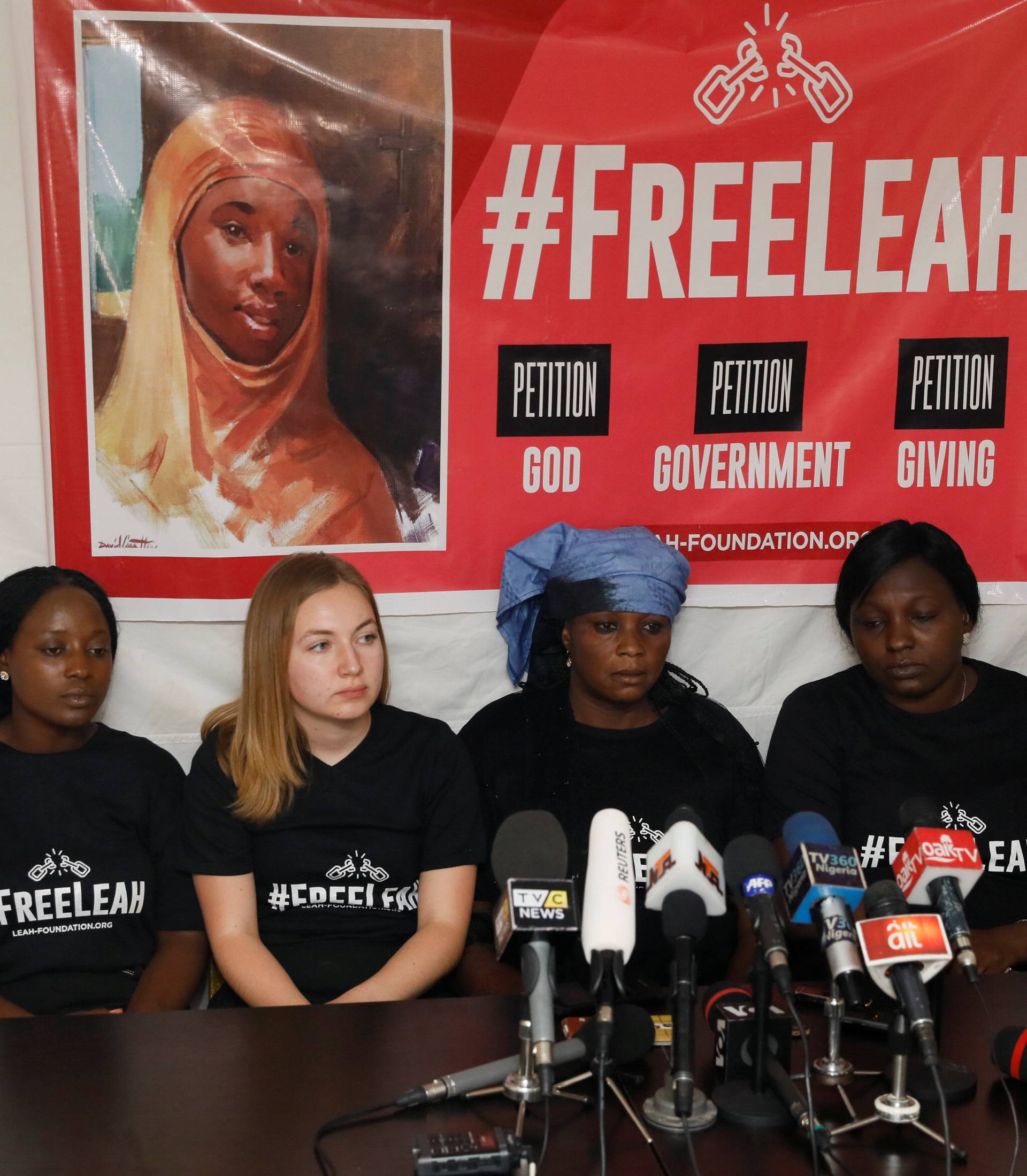 Dr Gloria Samdi Puldu, lecturer in the Departmentt of Political Science, University of Jos, with Rebecca Lubbert and Rebecca Sharibu, mother of Leah, attend a news conference at the Pope John Paul center in Abuja