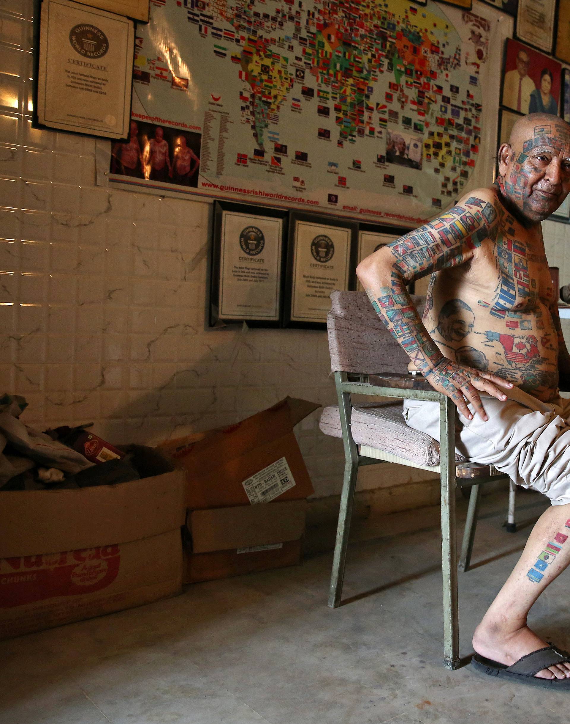 Guinness Rishi, multiple world record holder including most flags tattooed on his body, inside his apartment in New Delhi