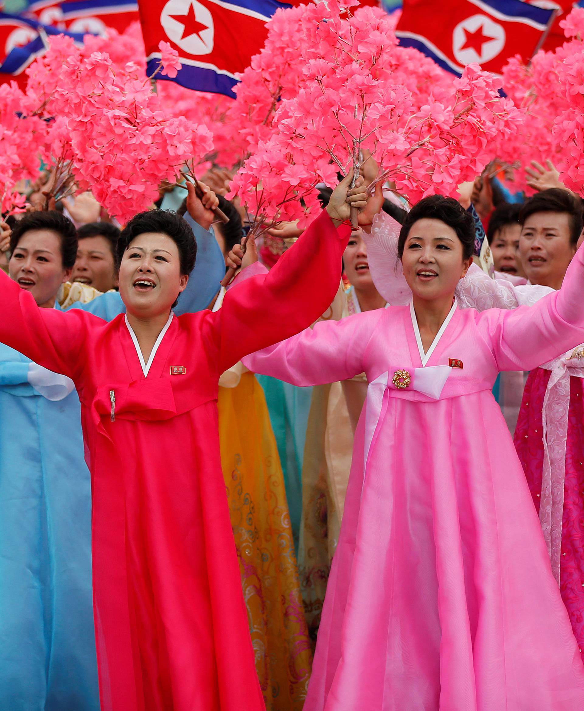 People react as they see North Korean leader Kim Jong Un during a mass rally and parade in Pyongyang