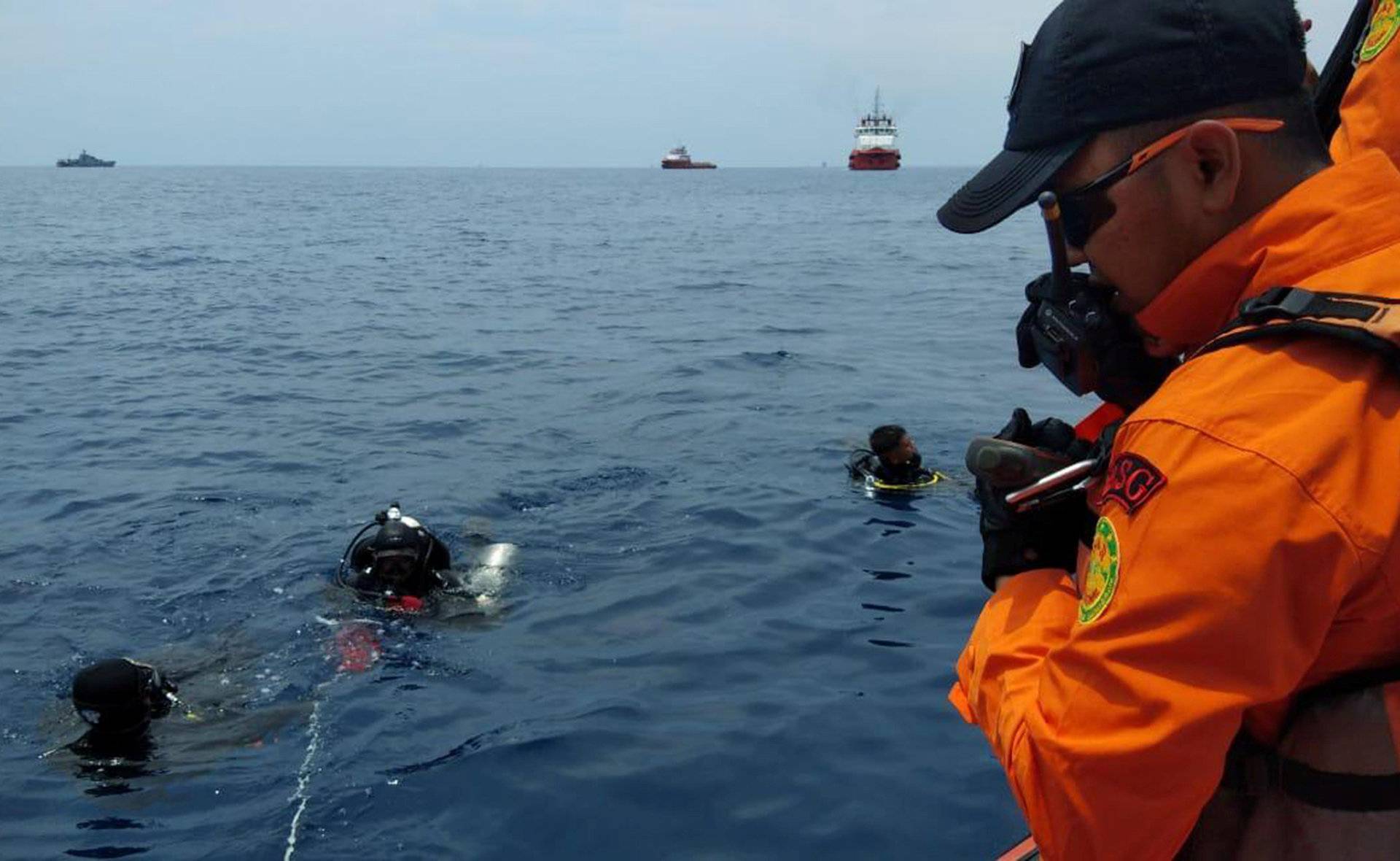 Rescue personnel prepare to dive at the location where a Lion Air plane crashed into the sea in the north coast of Karawang regency