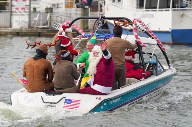 "Waterskiing Santa" skis along the Old Town Alexandria Waterfront in Virginia
