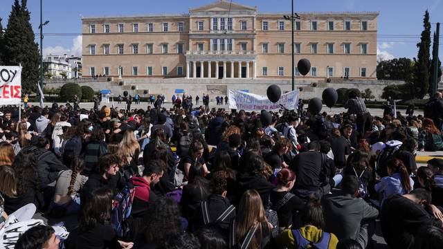 Protesters take part in a demonstration after a train crash near the city of Larissa, in Athens