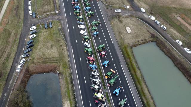 Tractors are lined up during a blockade by farmers on the A4 highway in Jossigny, near Paris