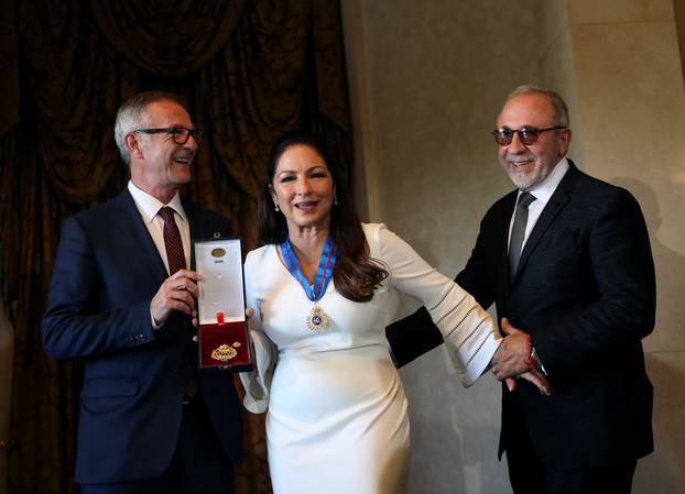 Cuban-American singer Gloria Estefan gets her husband Emilio Estefan to pose with her and Spain