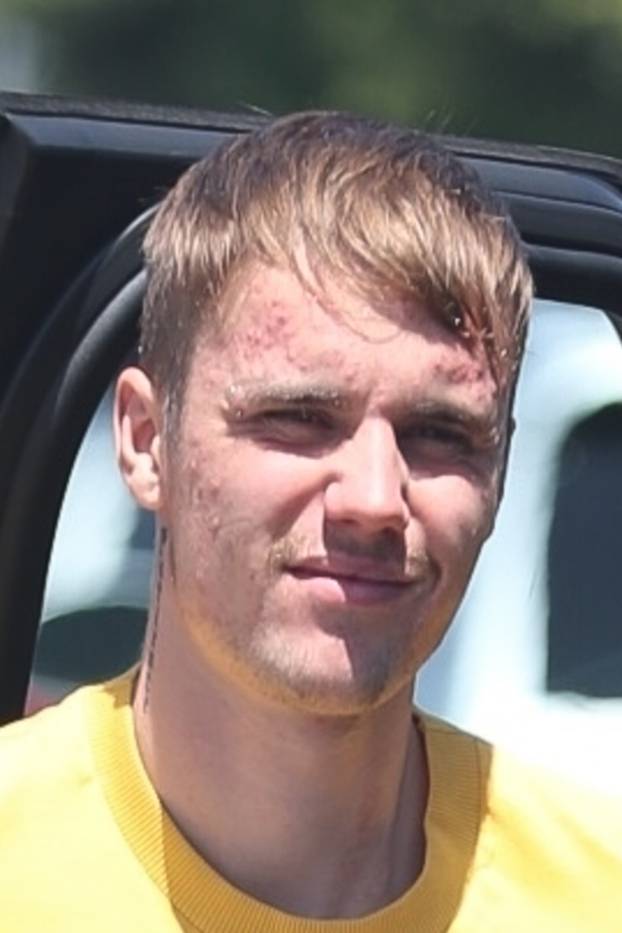 Justin Bieber posts DREW stickers all over town!