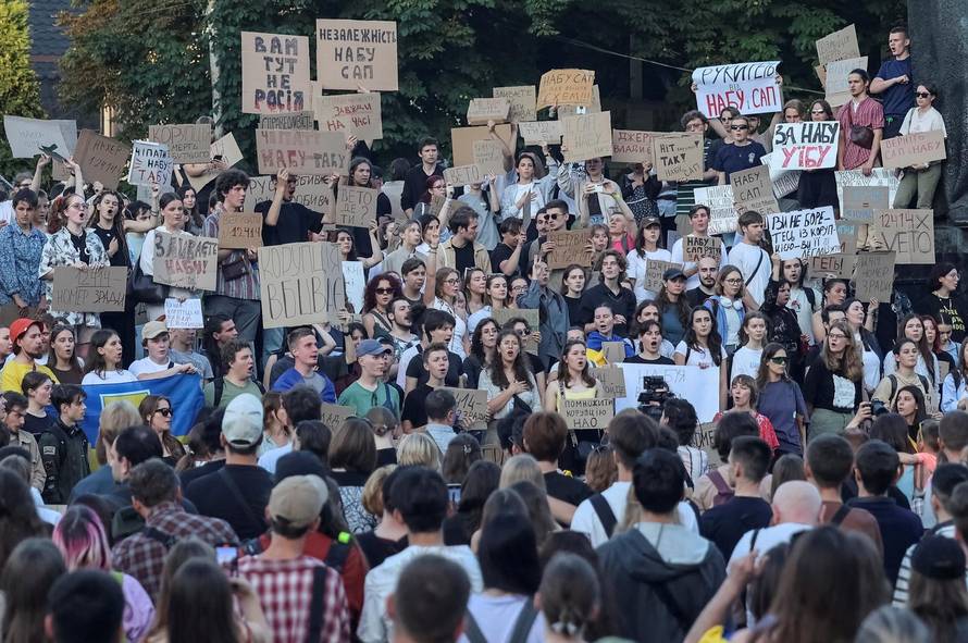 Ukrainians protest against a newly passed law, which curbs independence of anti-corruption institutions in central Lviv