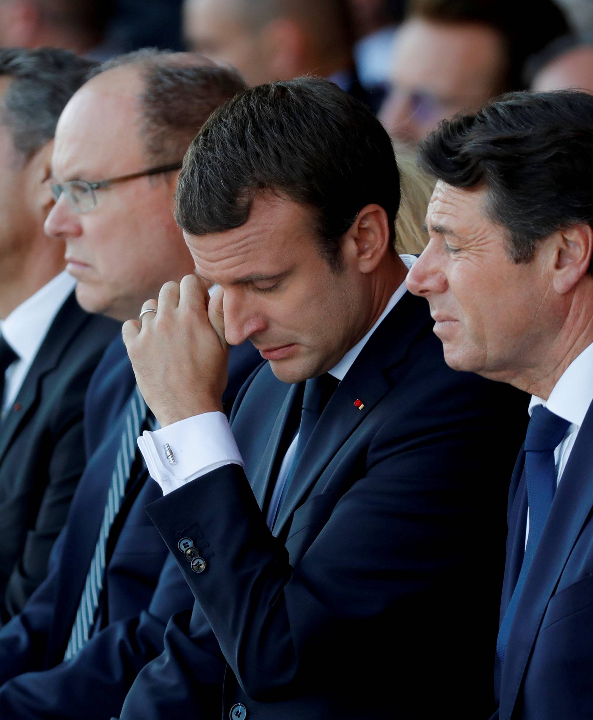 French President Emmanuel Macron reacts during the commemorative ceremony for last year's July 14 Bastille Day fatal truck attack on the Promenade des Anglais in Nice