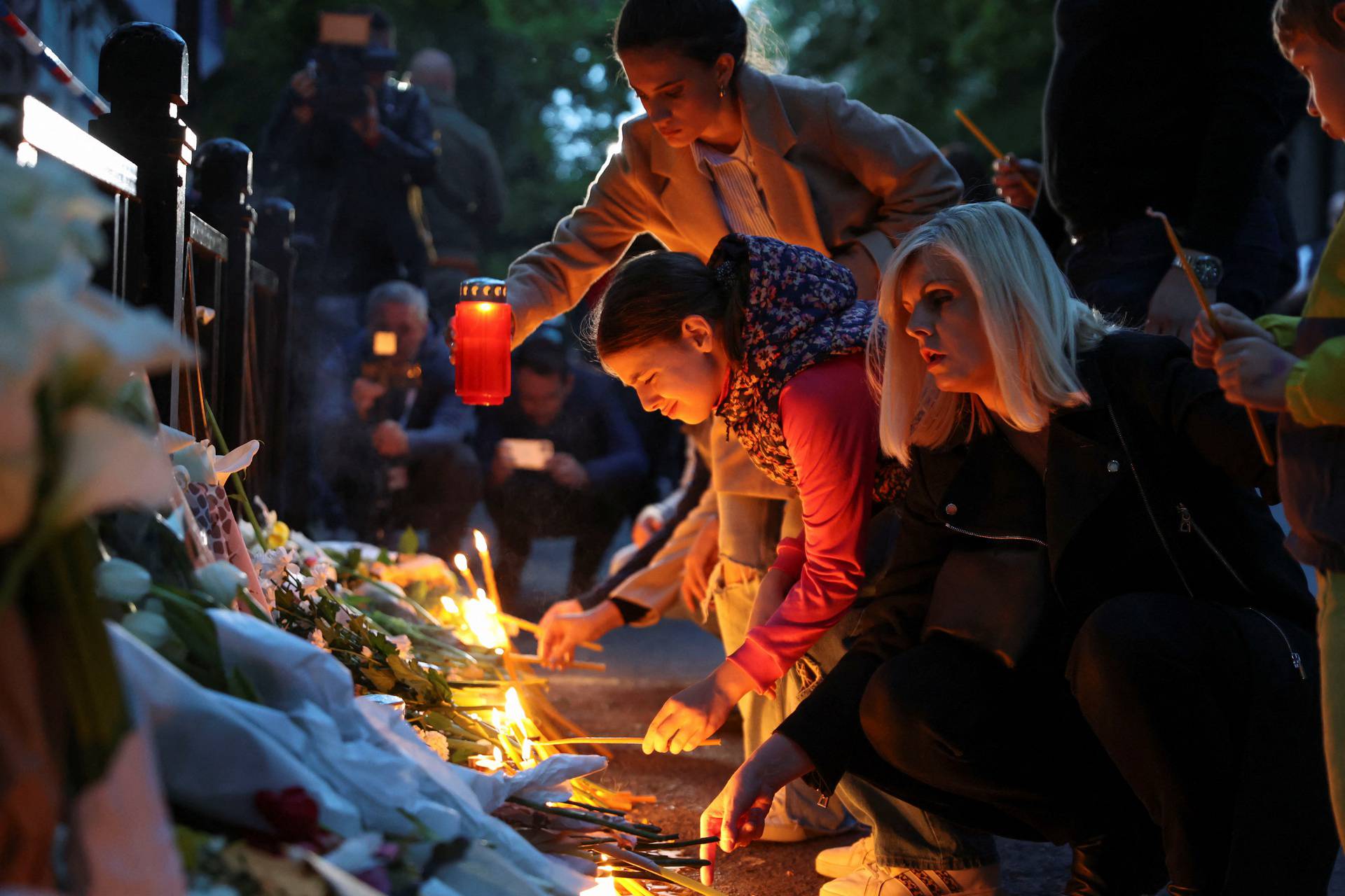 People gather to mourn victims of a school mass shooting, in Belgrade