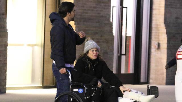 *EXCLUSIVE* Mick Jagger's ex Luciana Gimenez is seen for the first time in a wheelchair after fracturing her leg in a horror skiing accident in Aspen