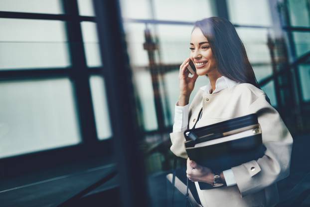 Portrait of young businesswoman going to office