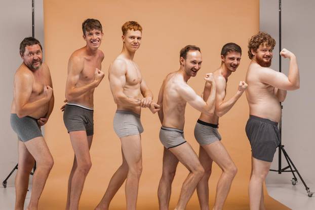 Group of emotional men of different ages having photo shoot at studio. Feeling happy, cheerful and comfortable. Concept of body positive, fashion, friendship