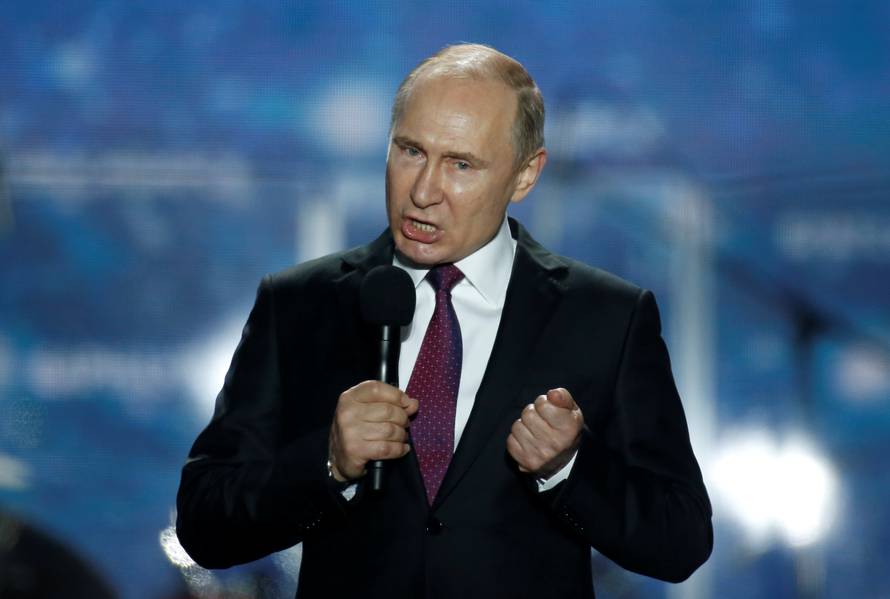 Russian president Vladimir Putin addresses the audience during a rally marking the fourth anniversary of Russia's annexation of Ukraine's Crimea region in the Black Sea port of Sevastopol