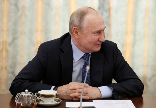 Russian President Vladimir Putin meets with war correspondents in Moscow