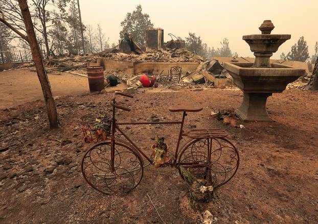 The debris of a burned home is seen after the Carr Fire west of Redding