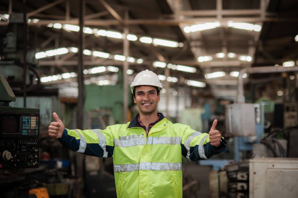 Happy,Young,Indian,Male,Engineer,Wearing,Safety,Workwear,Standing,In