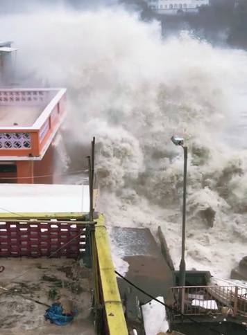 A giant wave strikes the coast in Hong Kong during Typhoon Mangkhut