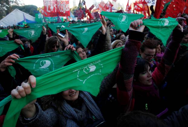 Demonstrators attend a protest in favour of legalising abortion outside the Congress while lawmakers debate an abortion bill in Buenos Aires