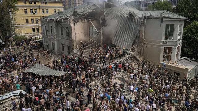 FILE PHOTO: Rescuers work at Ohmatdyt Children's Hospital that was damaged during Russian missile strikes, in Kyiv