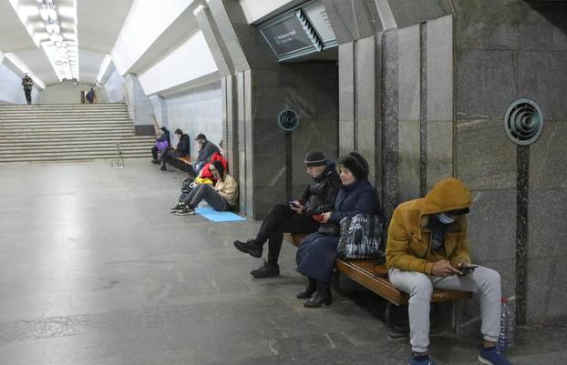 People gather in a metro station in Kharkiv