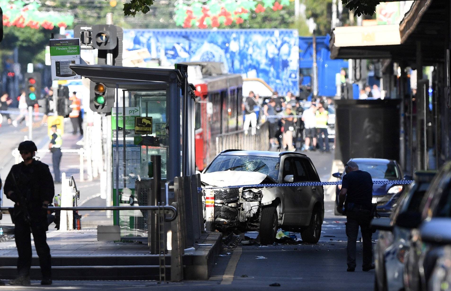Damaged vehicle is seen at the scene of an incident on Flinders Street, in Melbourne