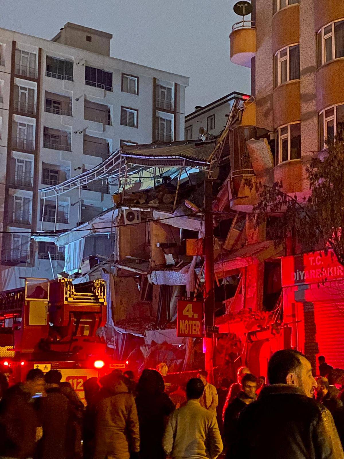 Emergency crew attends to a partially collapsed building following an earthquake in Diyarbakir