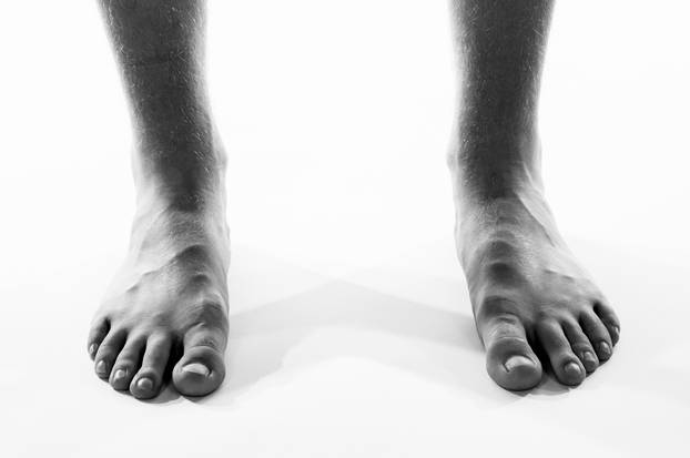 Black and white barefoot male feet