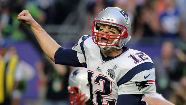 FILE PHOTO: New England Patriots quarterback Brady celebrates his second quarter touchdown pass against the Seattle Seahawks  to wide receiver LaFell during the NFL Super Bowl XLIX football game in Glendale
