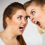 Two agressive women having argue fight