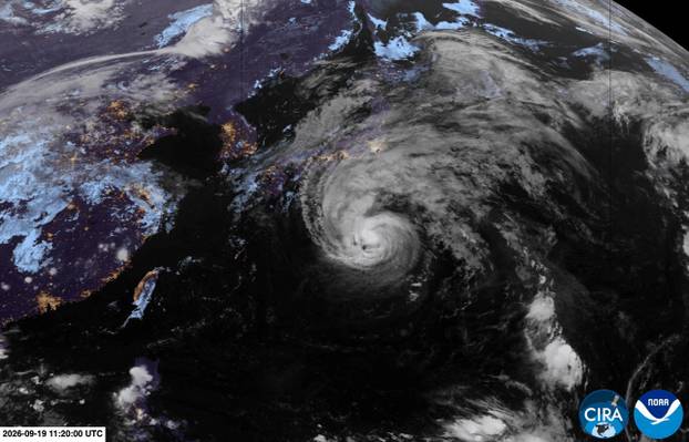 A satellite view shows a typhoon Dujuan approaching Japan