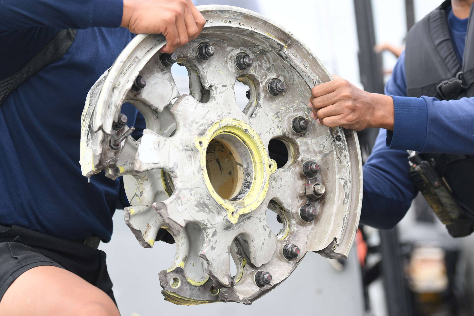 Indonesian navy personnel inspect what is believed to be the remains of the Sriwijaya Air plane flight SJ182, which crashed into the sea in Jakarta