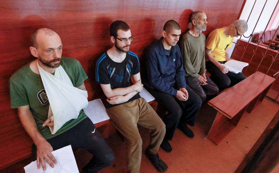 Foreign nationals captured during Ukraine-Russia conflict attend a court hearing in Donetsk