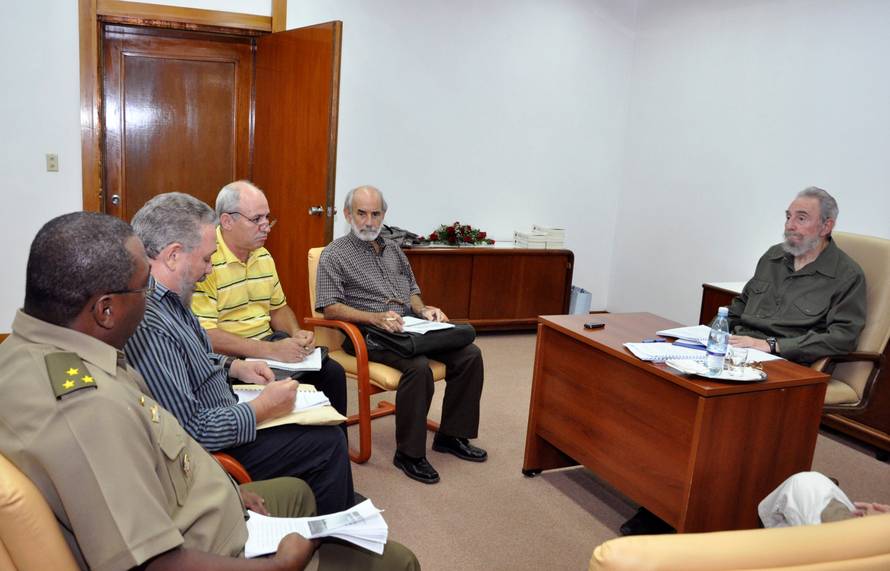 FILE PHOTO: Former Cuban leader Fidel Castro and his son Fidel Castro Diaz-Balart attend a meeting, in Havana