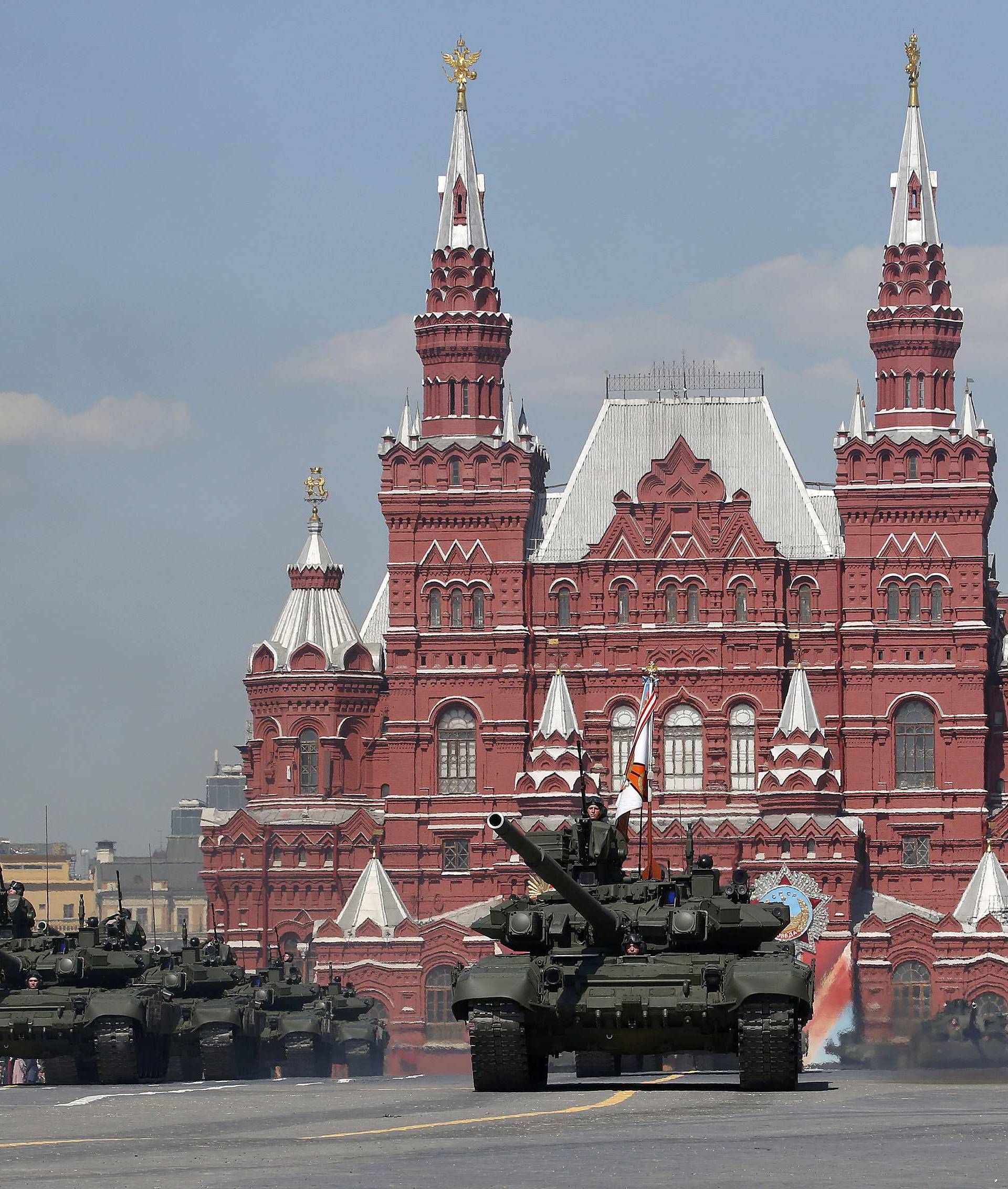 Russian servicemen stand atop T-90A main battle tanks during the Victory Day parade, marking the 71st anniversary of the victory over Nazi Germany in World War Two, at Red Square in Moscow
