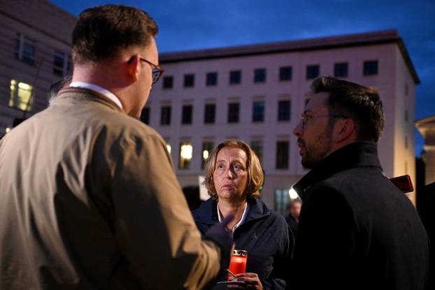 People gather to commemorate of Charlie Kirk in front of the Embassy of the United States in Berlin