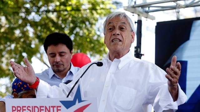 Chilean presidential candidate Sebastian Pinera speaks and takes part in a campaign rally in Santiago