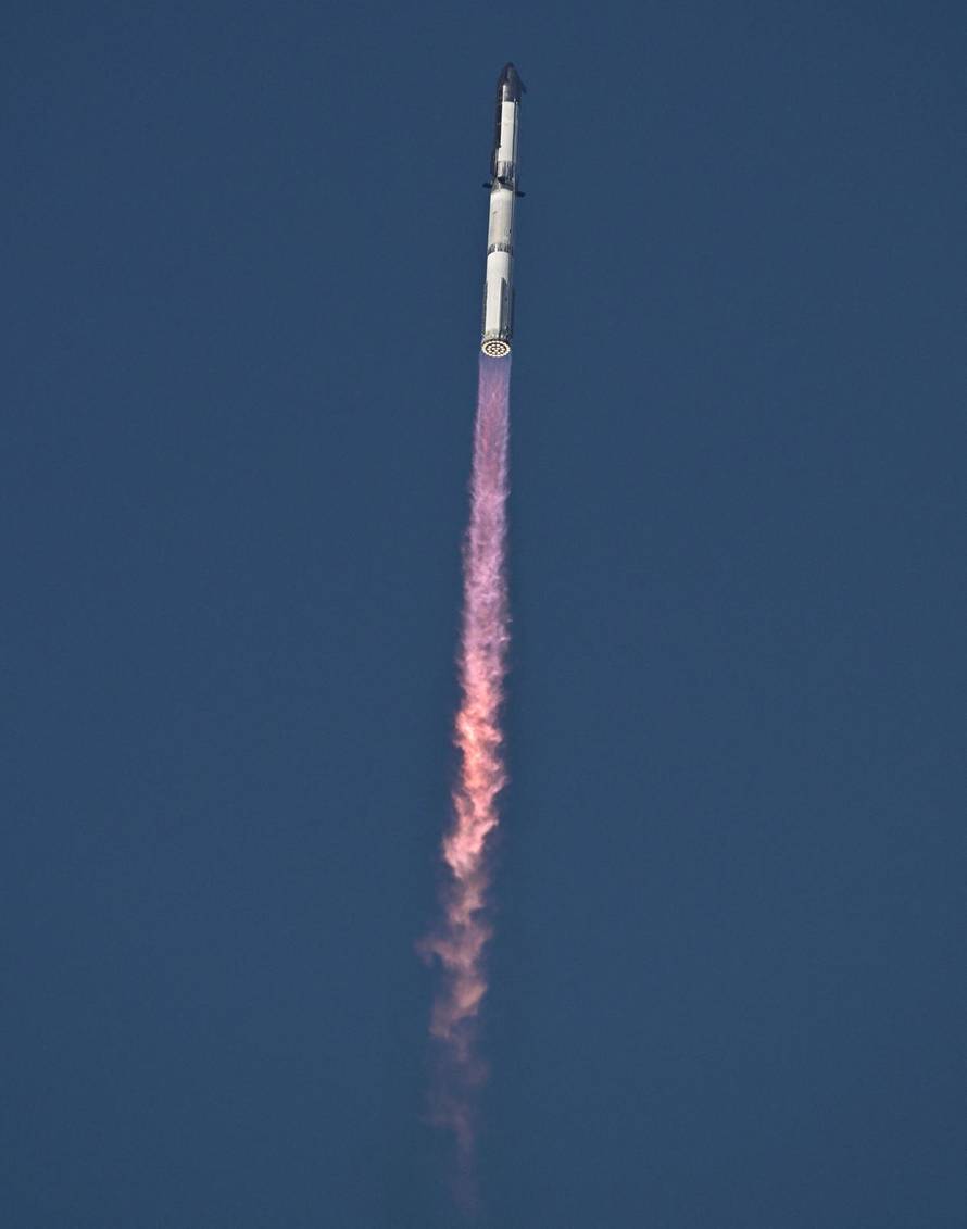 A SpaceX Super Heavy booster carrying the Starship spacecraft lifts off on its 10th test flight