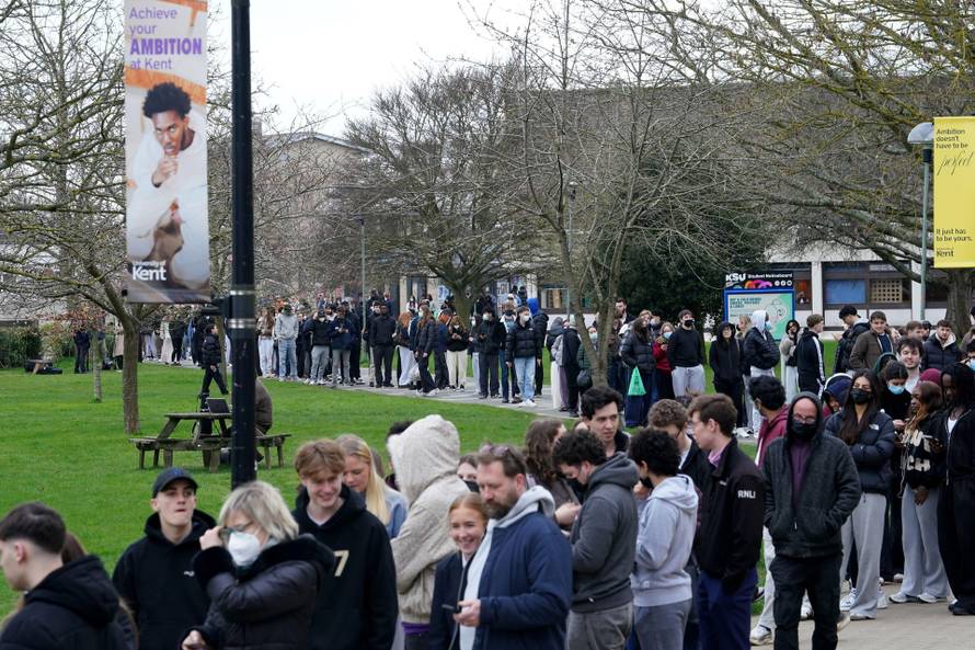 Students queuing for antibiotics outside a building at the University of Kent in Canterbury. The university have confirmed that a student was one of two people who have died as a result of meningitis in the area. The UK Health Security Agency (UKHSA) said