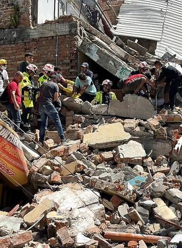 Collapsed buildings in Pereira after earthquake strikes Colombia