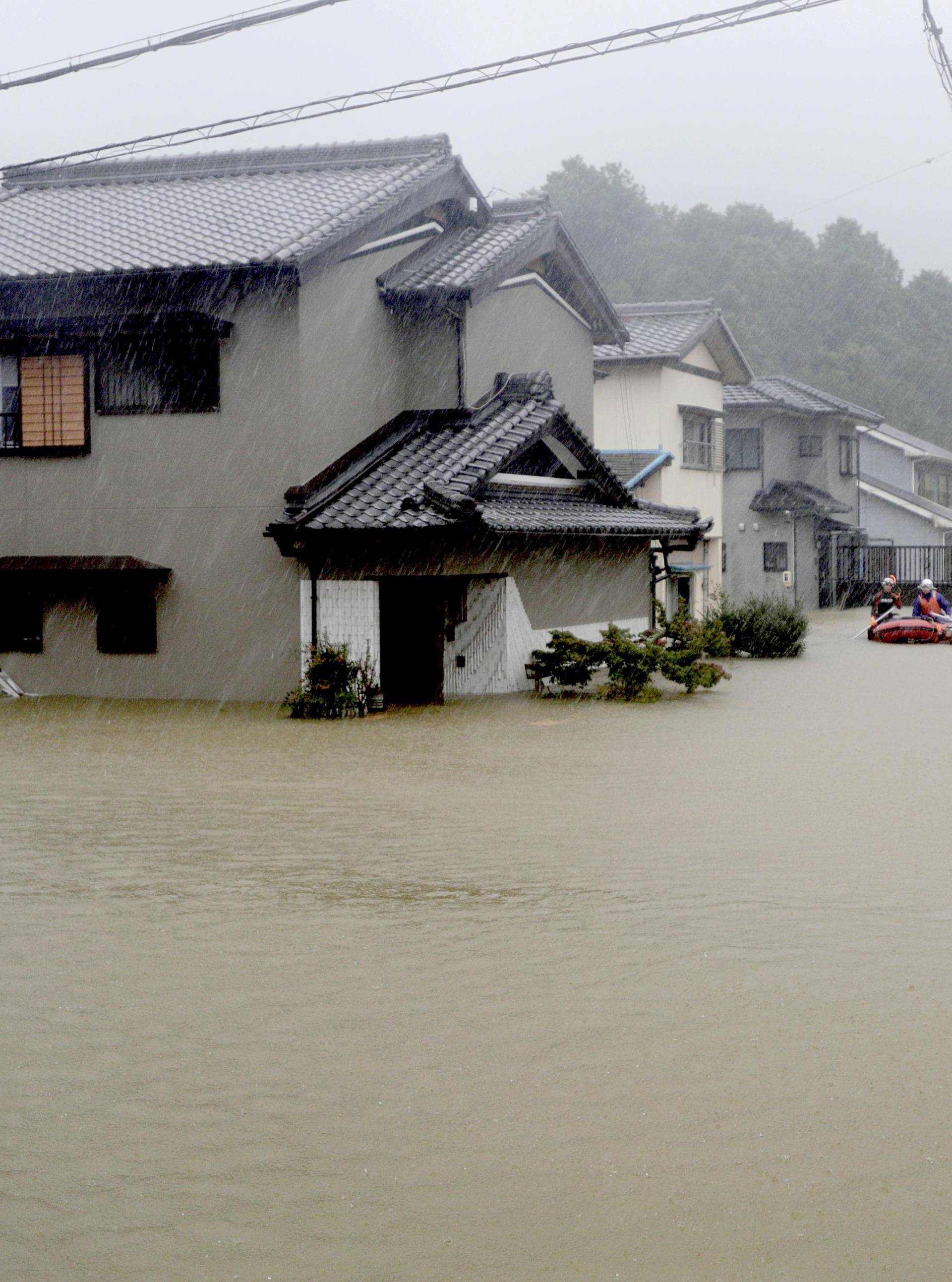 Heavy rains caused by Typhoon Hagibis flood a residential area in Ise