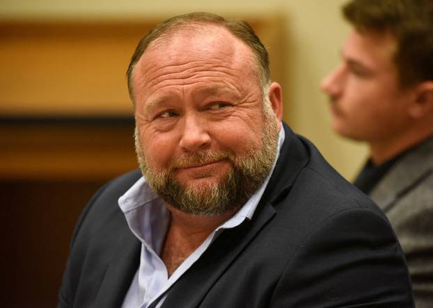 FILE PHOTO: Infowars founder Alex Jones takes the witness stand to testify