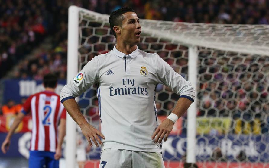 Real Madrid's Cristiano Ronaldo celebrates scoring their third goal and his to complete his hat trick