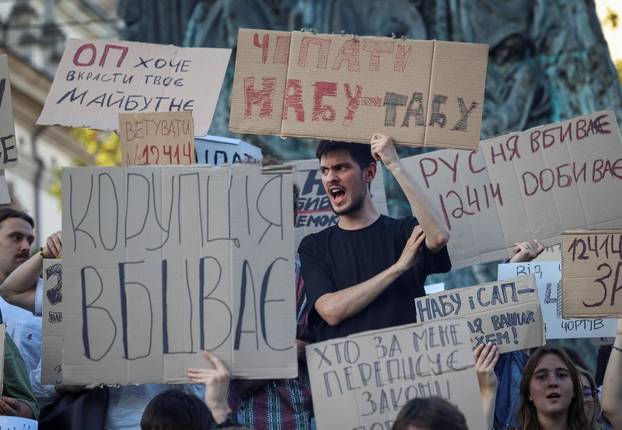 Ukrainians protest against a newly passed law, which curbs independence of anti-corruption institutions in central Lviv