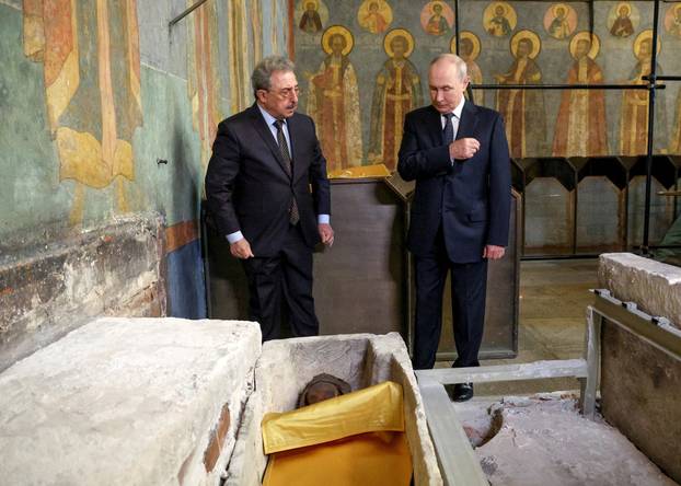 FILE PHOTO: Russian President Vladimir Putin visits the Archangel Cathedral of the Kremlin in Moscow