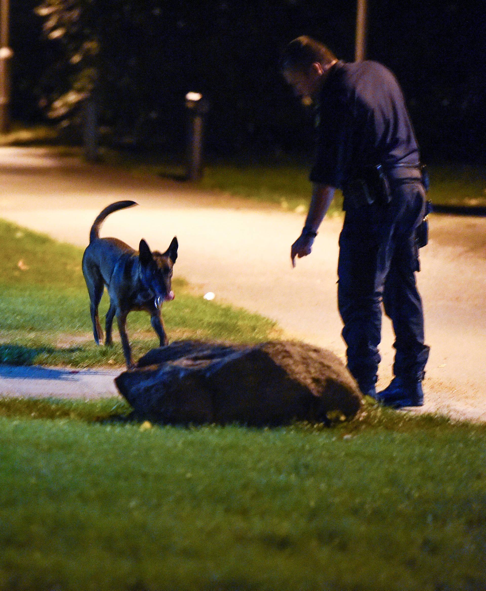 Police investigating the area after a shooting in southern Malmo