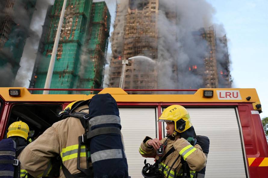 Flames engulf bamboo scaffolding across multiple buildings at Wang Fuk Court housing estate, in Tai Po