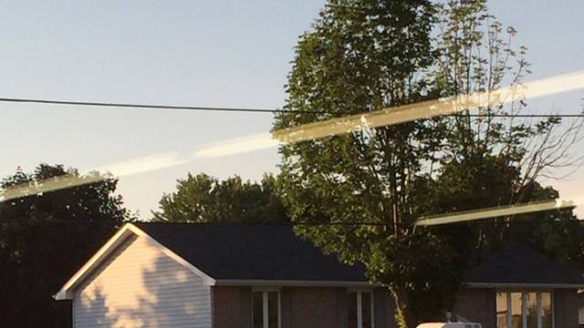 Police vehicle is parked during a raid on a home (not pictured) at a small community some 225 km (140 miles) southwest of Toronto in Strathroy Ontario