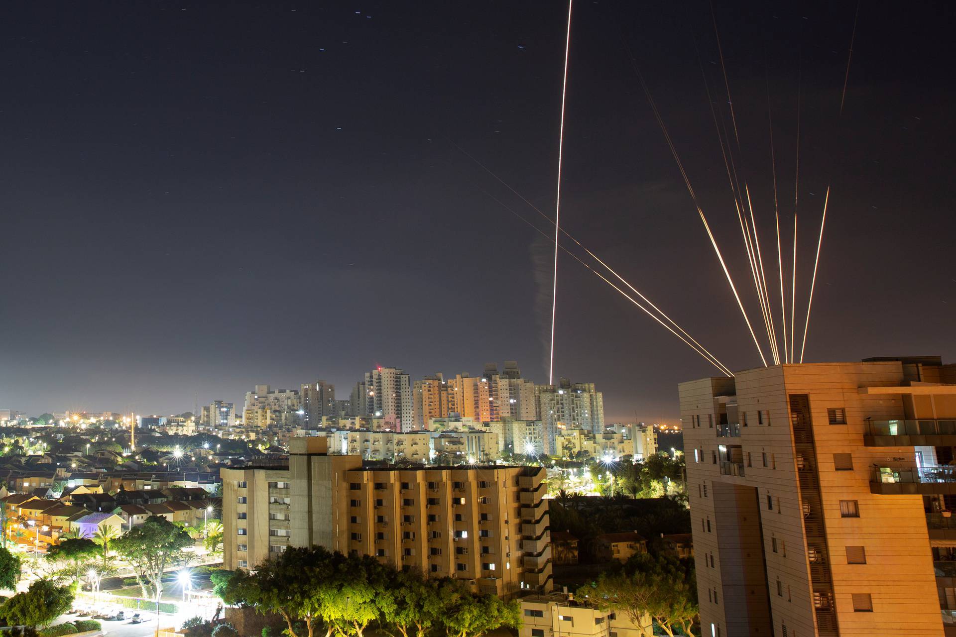 Streaks of lights are seen from Ashkelon as rockets are launched from the Gaza Strip towards Israel